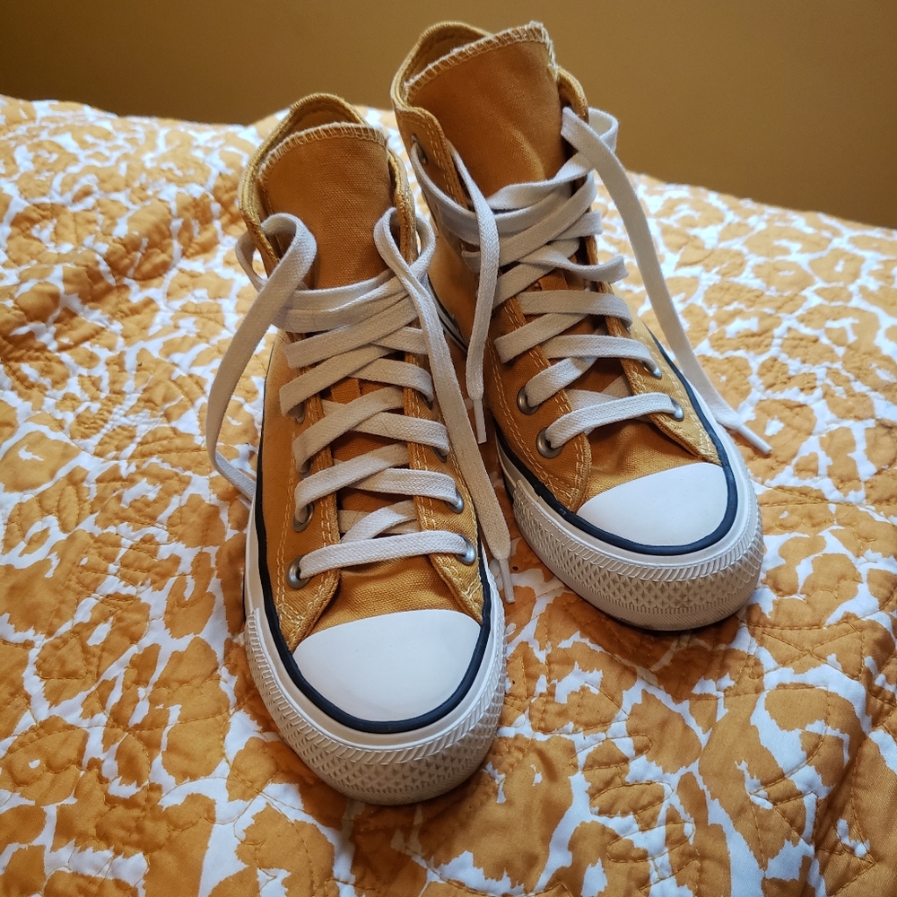 Yellow Chuck Taylor Converse shoes